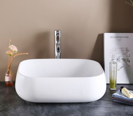 Раковина из сантехнического фаянса CeramaLux 9243 60х40 накладная цвет белый без отверстий под смеситель