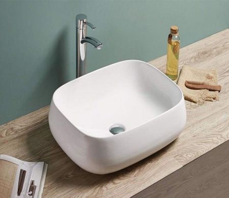 Раковина из сантехнического фаянса CeramaLux 9243 60х40 накладная цвет белый без отверстий под смеситель